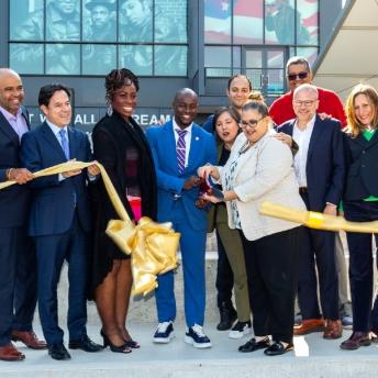 Partners group photo at the ribbon cutting of Bronx Point, in the Bronx